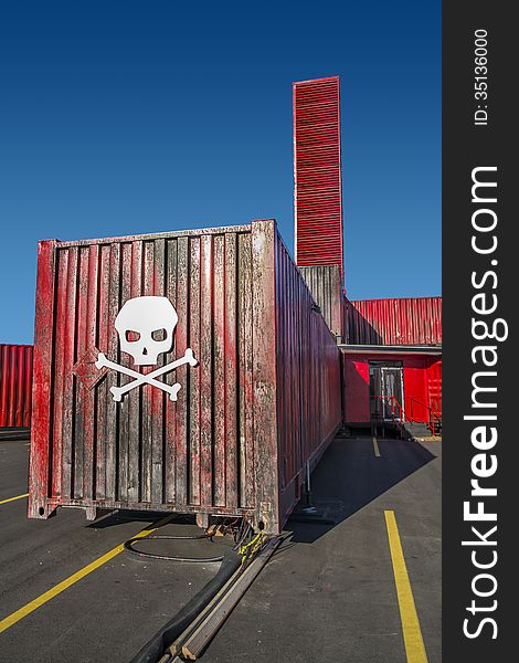 Red cargo container in a parking lot. Red cargo container in a parking lot