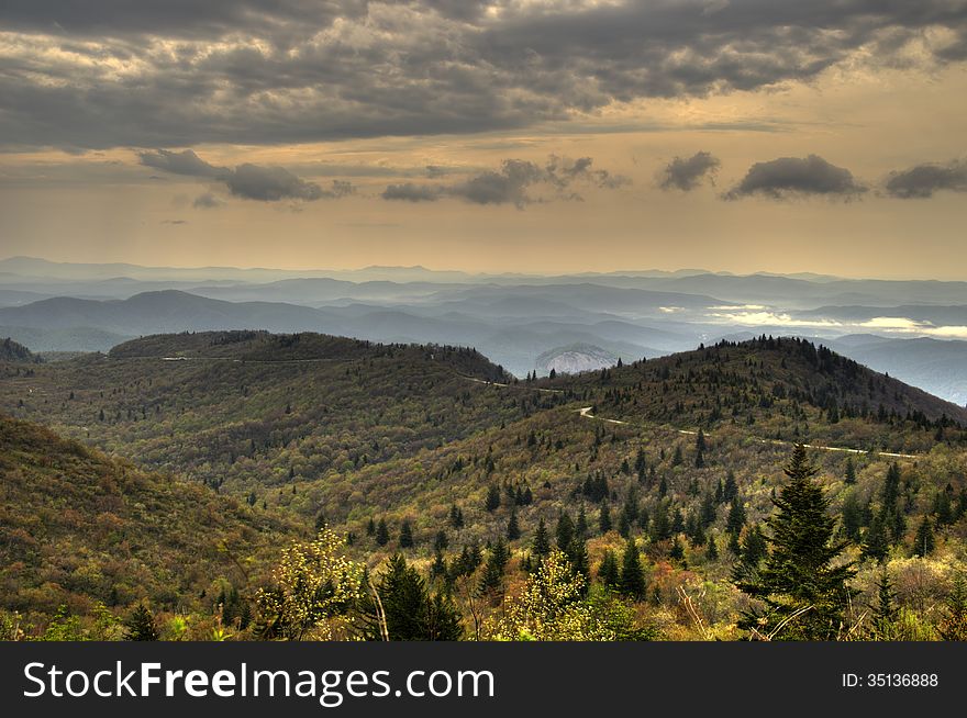 The Blue Ridge Mountains with Looking Glass Rock in the Distance. This is taken near the Blue Ridge Parkway in the Autumn. The Blue Ridge Mountains with Looking Glass Rock in the Distance. This is taken near the Blue Ridge Parkway in the Autumn