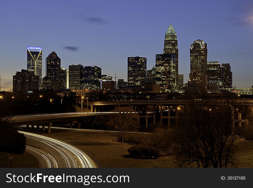 Charlotte North Carolina during twilight. This is a long exposure shot to catch the streaks of the headlights from the cars. Charlotte North Carolina during twilight. This is a long exposure shot to catch the streaks of the headlights from the cars.