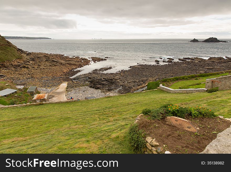 View from Cape Cornwall headland England UK in direction of Land's End near St Just on an overcast day. View from Cape Cornwall headland England UK in direction of Land's End near St Just on an overcast day