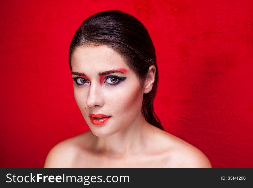 Beauty makeup portrait on red background