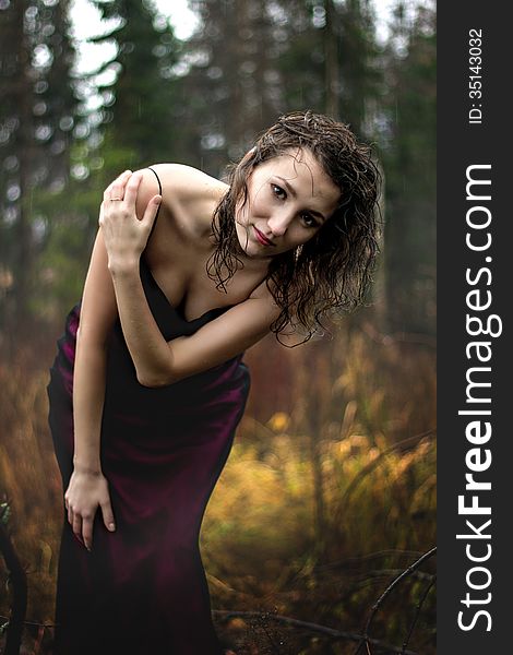 Portrait Of Woman In Purple Dress Under Rain