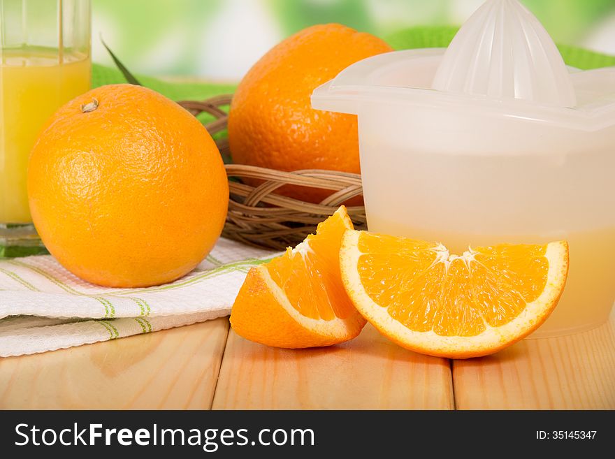 Orange Macrophoto Against A Juice Extractor