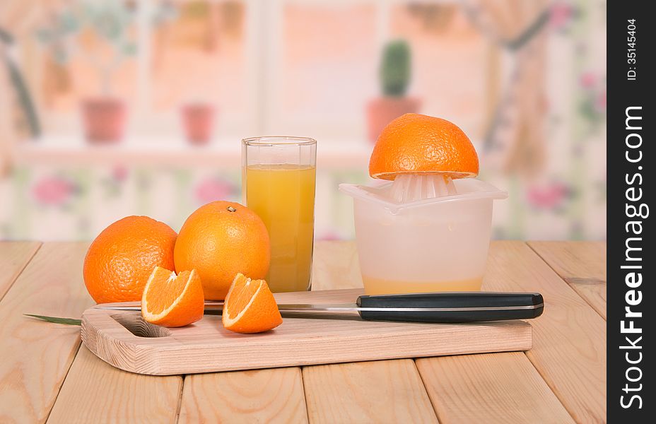 Knife, Segments Of Orange And A Juice Glass