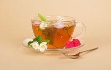 Cup Of Flower Tea Spoon And Raspberry On Beige Royalty Free Stock Photo Cup Of Flower Tea Spoon And Raspberry On Beige Royalty Free Stock Photo