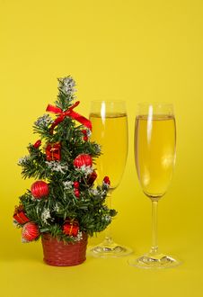 Small Christmas Fir-tree In A Pot, And Two Wine Stock Photo Small Christmas Fir-tree In A Pot, And Two Wine Stock Photo