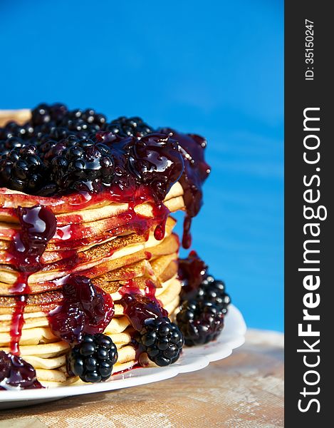 Pancakes and blackberry with syrup poured on top. Pancakes and blackberry with syrup poured on top