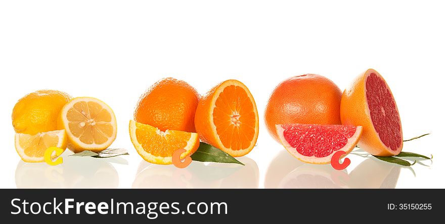 Lemon, orange and grapefruit in a section isolated on the white