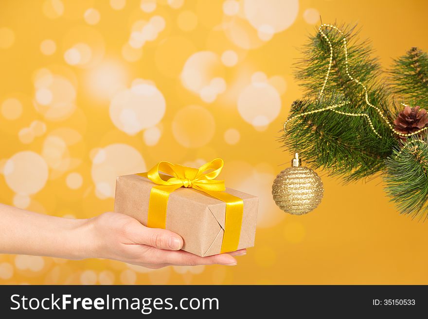 Branch of Christmas fir-tree with ornament and