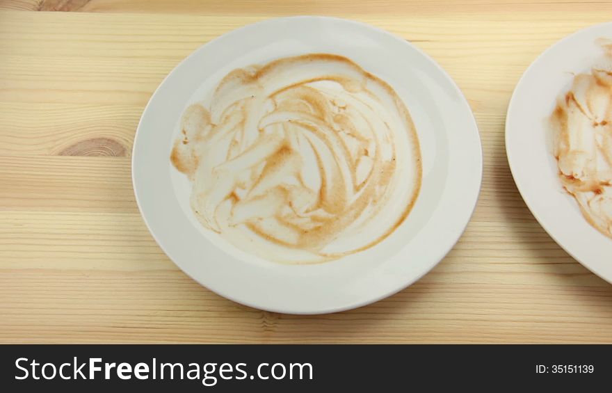 Wooden table. Three empty dirty plates. Men's hands is put fork and knife in the latest empty plate. Wooden table. Three empty dirty plates. Men's hands is put fork and knife in the latest empty plate