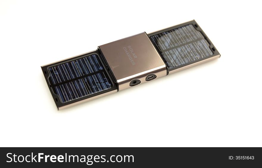 White background. Portable solar charger is rotated