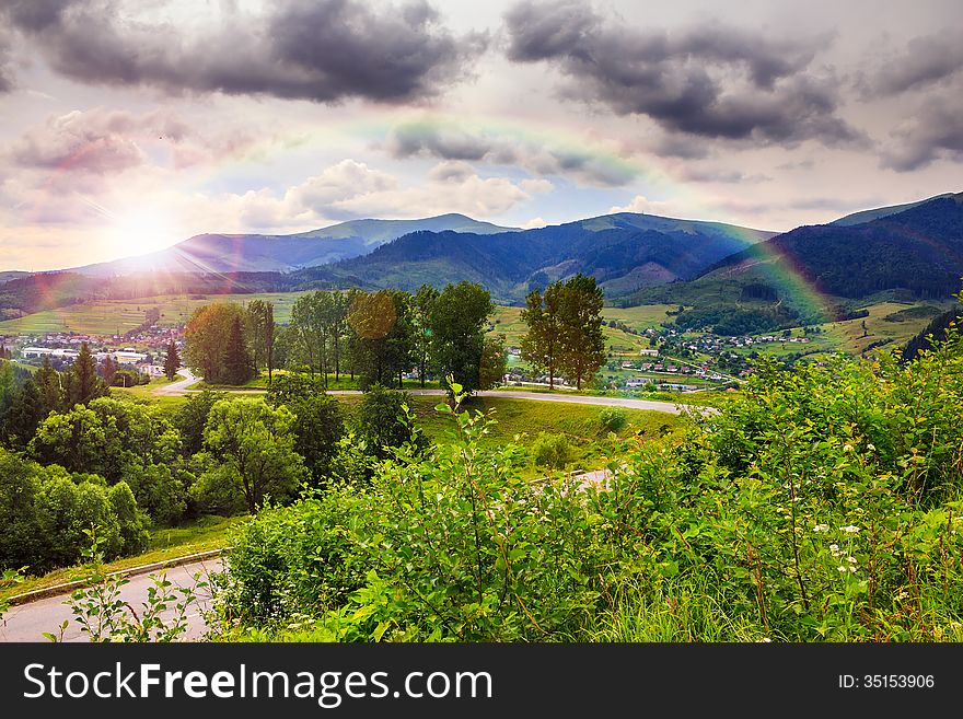 Valley near forest on a steep mountain slope after the rain in evening mood