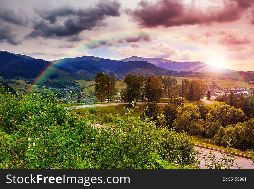 Valley near forest on a steep mountain slope after the rain in evening mood