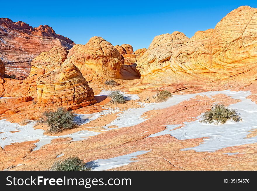 Hiking through The Wave is comparable to walking through a spectacular maze of swirling, undulating rock. Hiking through The Wave is comparable to walking through a spectacular maze of swirling, undulating rock.