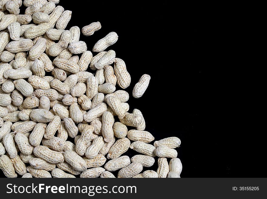 Spill Peanuts on black background