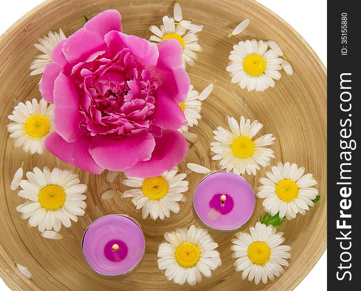 Heads Of Camomiles, A Peony And Burning Candles In