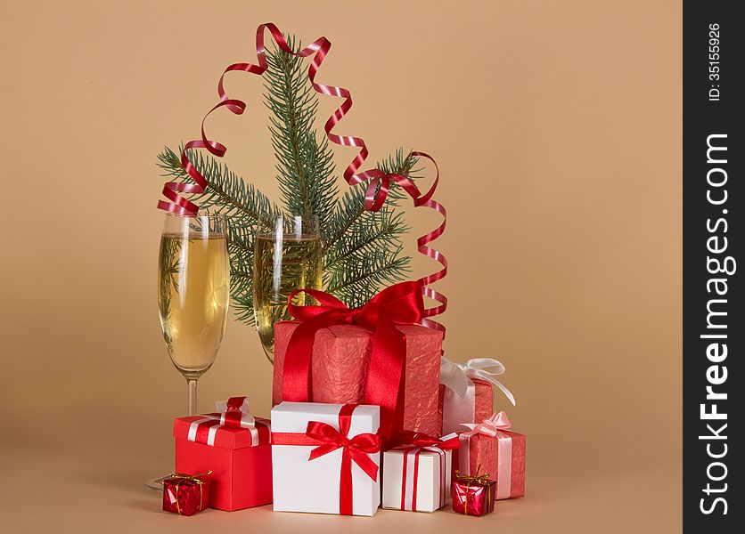 Fir-tree branch, wine glasses with champagne