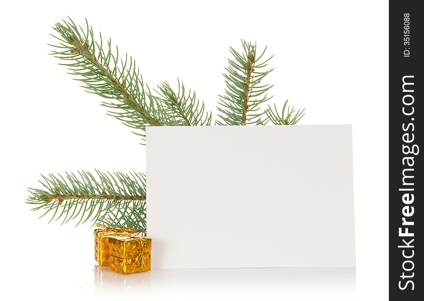 Fir-tree branch, small gift boxes and the empty card isolated on white