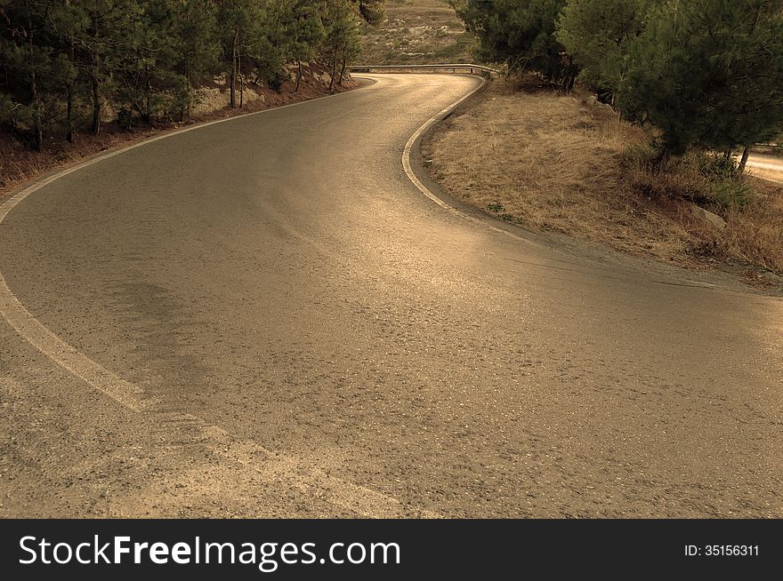 Winding mountain road. Sepia toned this image. Winding mountain road. Sepia toned this image