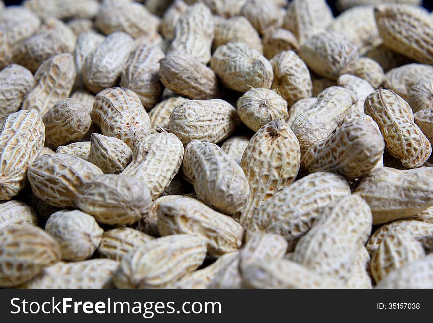 Spill Peanuts on black background