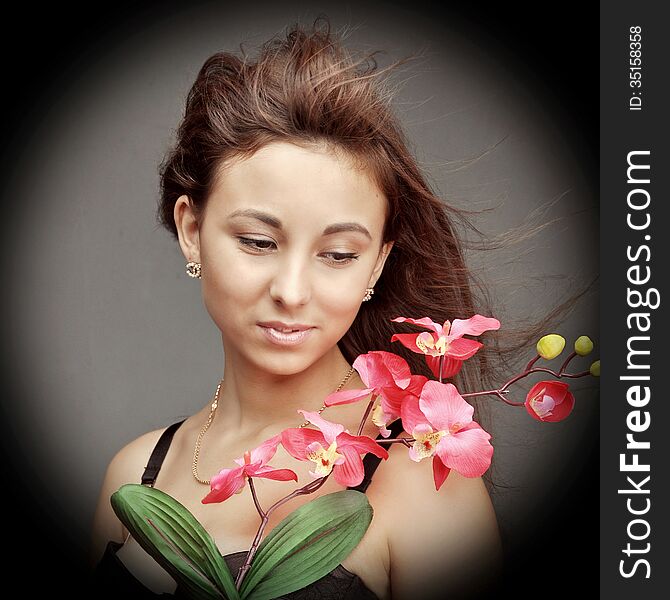Young Caucasian Woman With Orchid