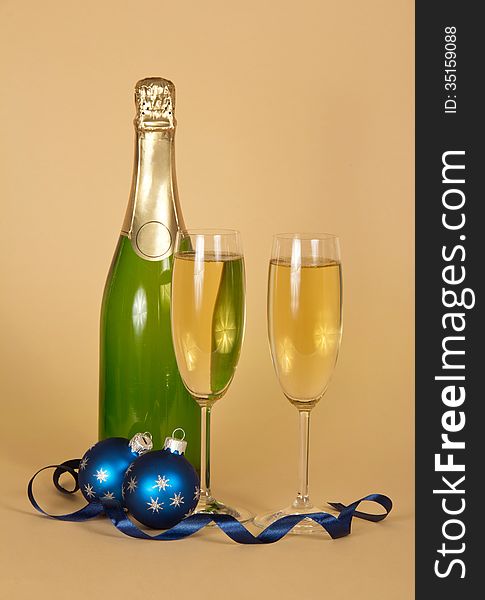 Bottle, wine glasses with champagne and Christmas