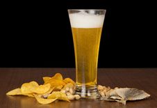 Glass Of Foamy Beer With Bubbles, Chips, Salty Royalty Free Stock Image