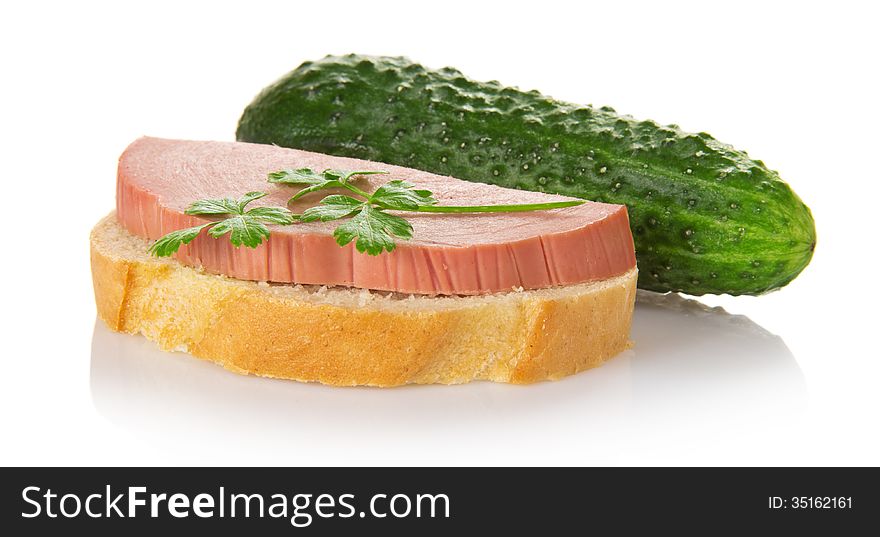 Sandwich with the sausage, parsley and green cucumber, isolated on white