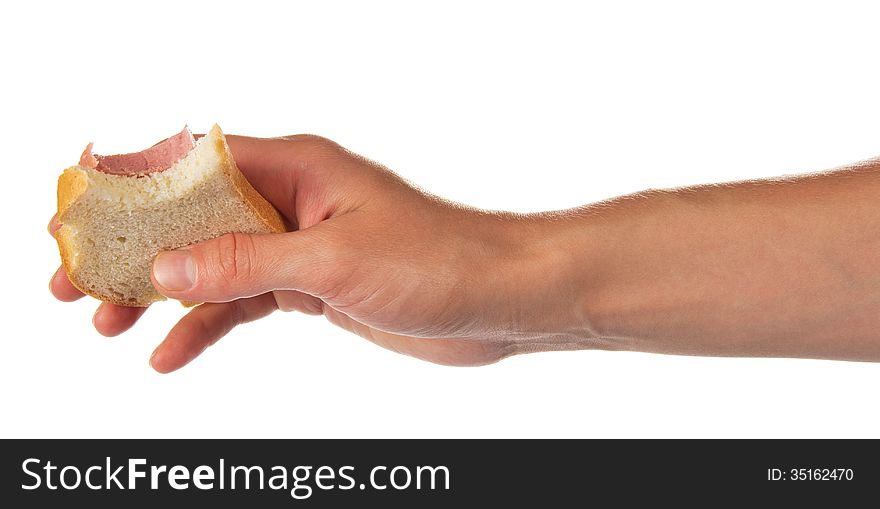 Sandwich from which bit off a slice, in the female hand, isolated on white