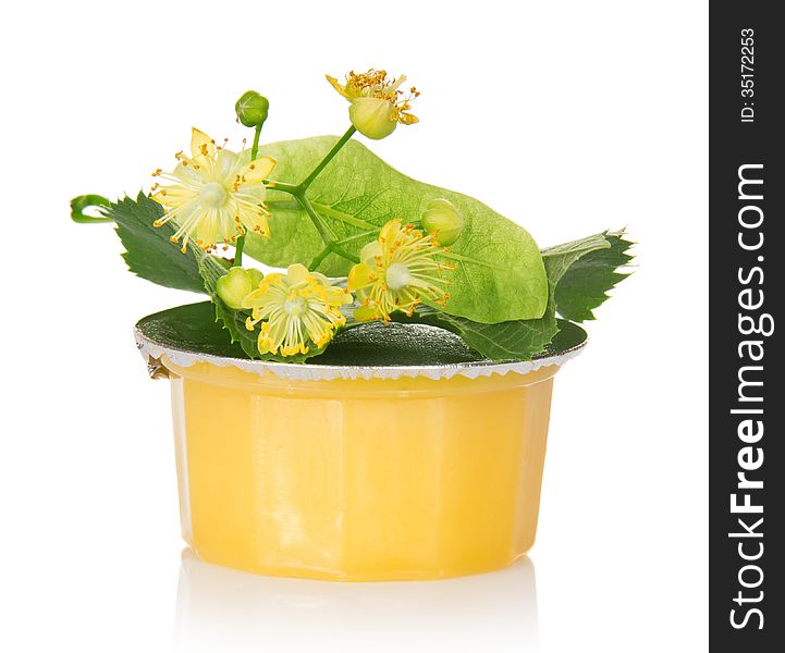 Jar of linden honey isolated on white