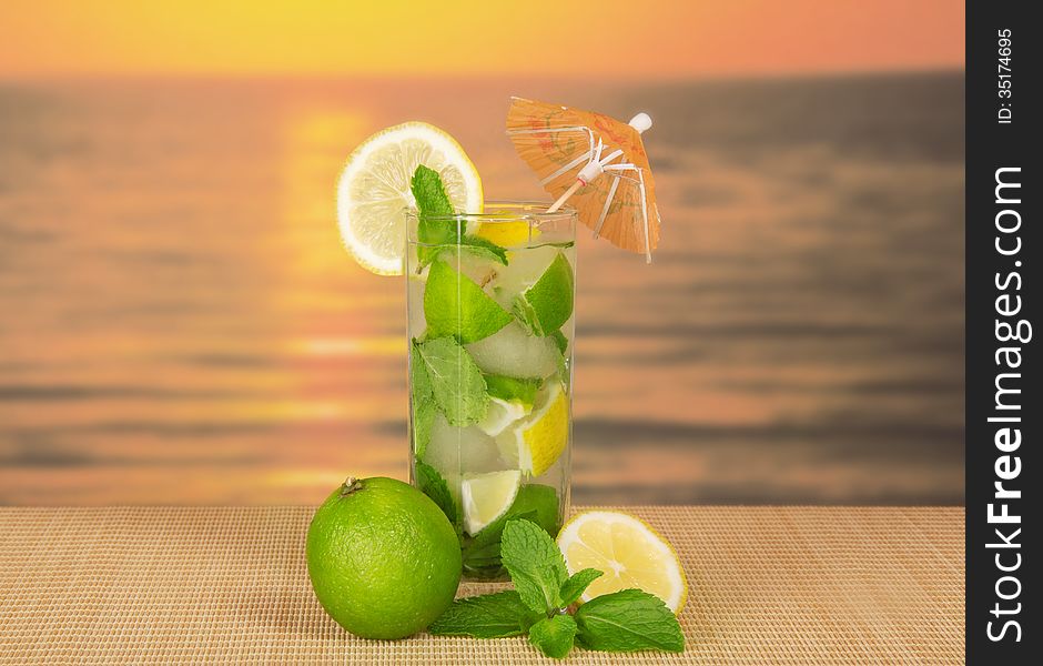 Glass about mojito, lime and mint