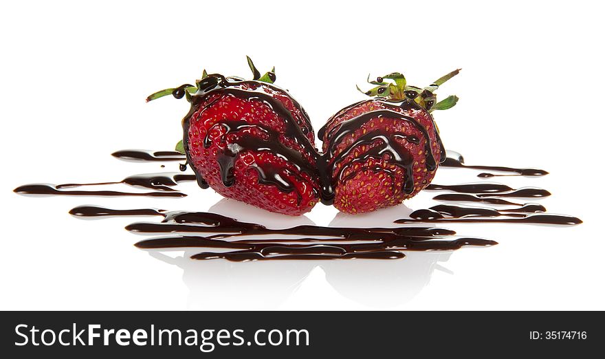 Fresh fragrant strawberry, decorated with chocolate, isolated on white