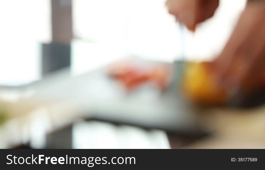 Hand slicing bell pepper,shifting focus