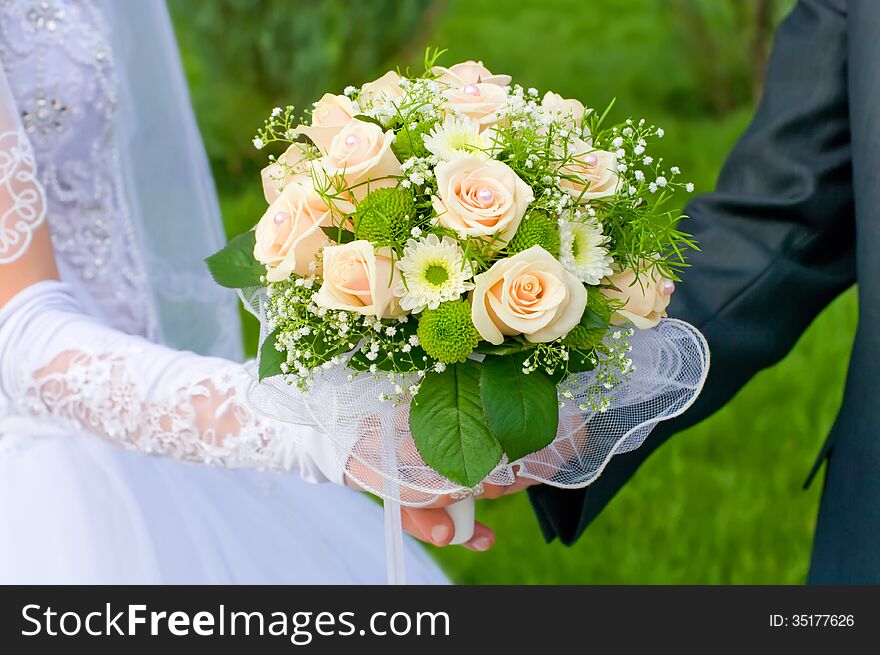 Wedding theme, holding hands honeymoon bridal bouquet. Wedding theme, holding hands honeymoon bridal bouquet