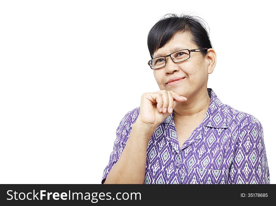 Senior woman smilingly and touching her chin