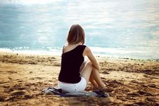 Lonely Girl Relaxing On The Sea Beach Royalty Free Stock Images Lonely Girl Relaxing On The Sea Beach Royalty Free Stock Images