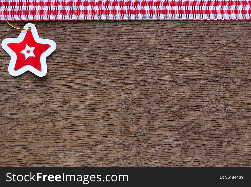 Paper star on a  wooden  background