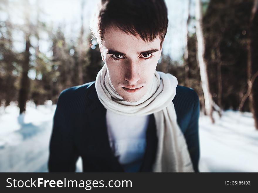 Portrait of a man in snow forest