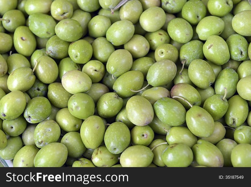 Green olives in a box on the market