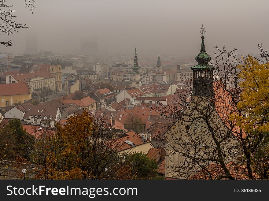 Bratislava view from the castle. Misty atmosphere hides the more modern buildings. Bratislava view from the castle. Misty atmosphere hides the more modern buildings