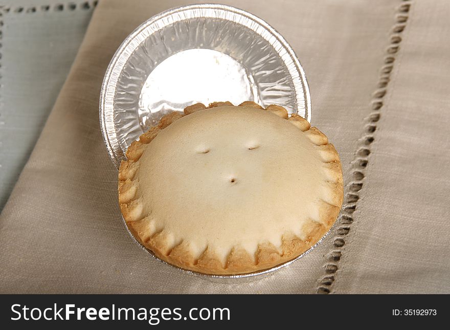 Pastry with jam inside on napkin.