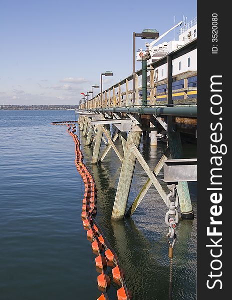 A commercial pier with protective netting around it. A commercial pier with protective netting around it