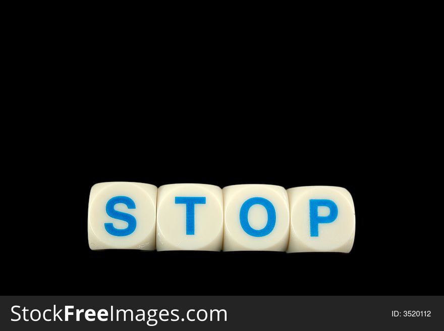 The word stop spelled in blocks isolated