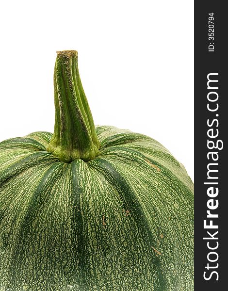 Green ripe pumpkin close-up isolated over a white background