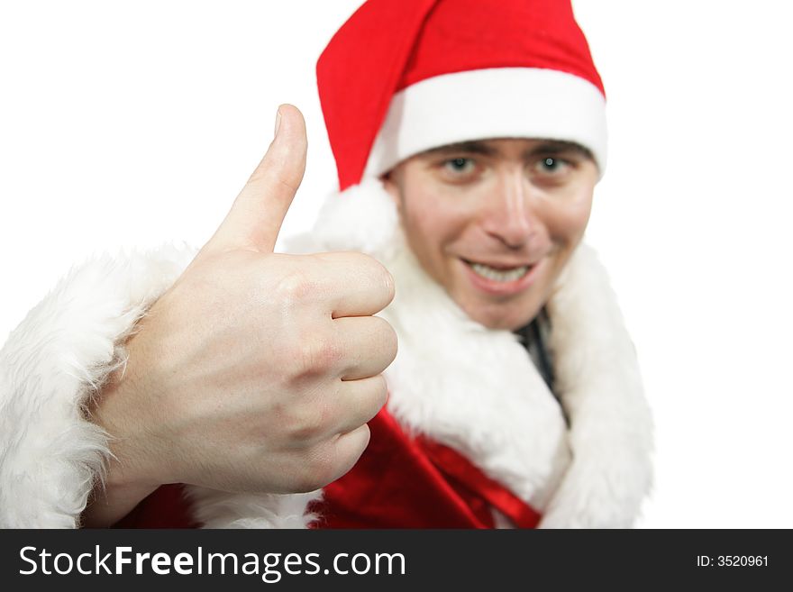 Businessman clothed in costume of Santa show thumb up isolated over white background. Shallow DOF, focus on the hand.