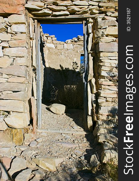 A view through the door of an old abandoned structure built of carefully assembled stones. A view through the door of an old abandoned structure built of carefully assembled stones.