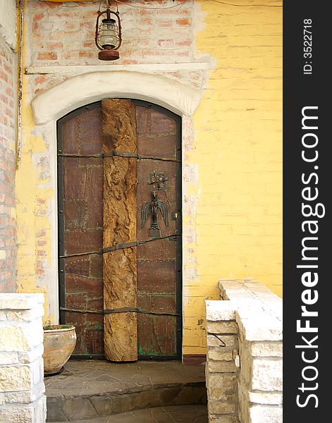 Ancient stone doorway and old door. Ancient stone doorway and old door