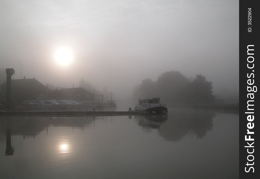 French channel boat in a foggy weather morning