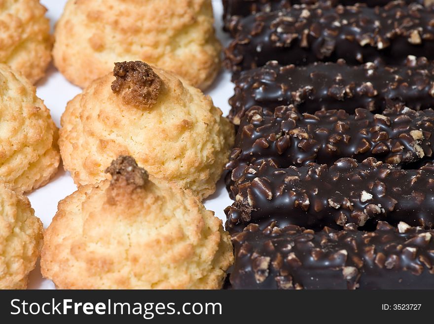 Background view of coconut cookies and chocolate waffles. Background view of coconut cookies and chocolate waffles.