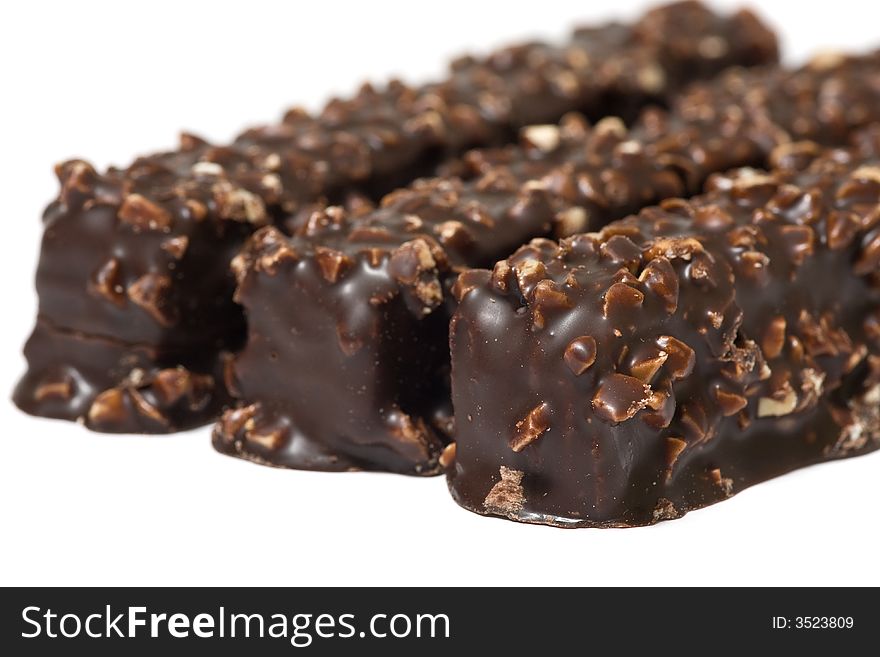 Side view of three chocolate waffles isolated on white background